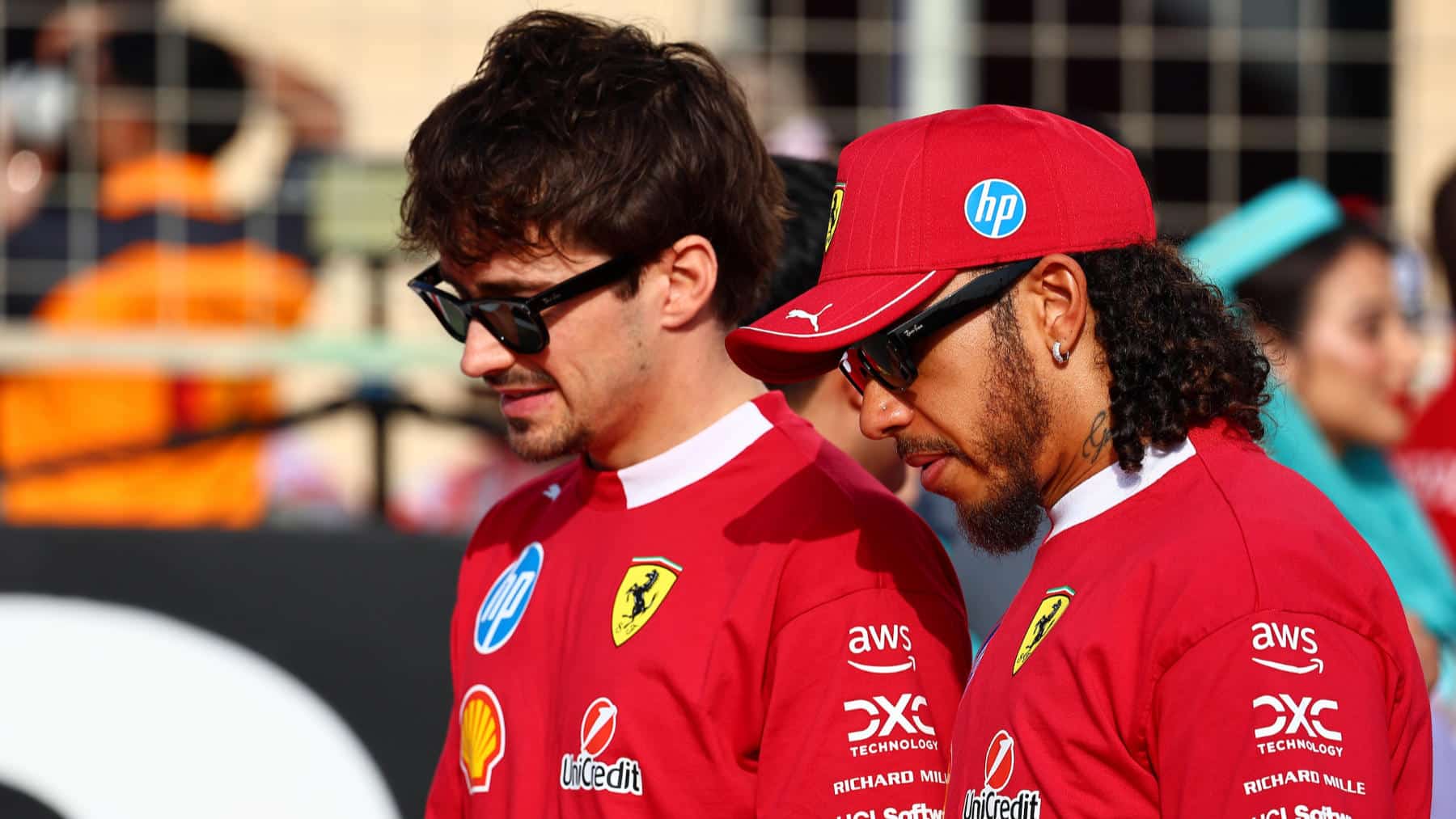 Ferrari drivers Charles Leclerc and Lewis Hamilton before the 2025 Bahrain Grand Prix