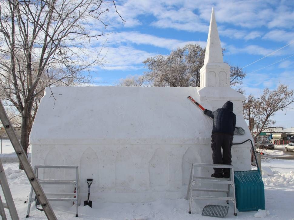 Man working on snow sculpture (GW)