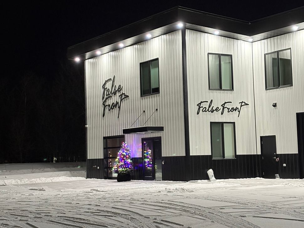 the exterior of a building that reads False Front 