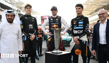 FIA president Mohammed Ben Sulayem, McLaren's Oscar Piastri, Red Bull's Max Verstappen, McLaren's Lando Norris and F1 president Stefano Domenicali pose with the FIA F1 drivers' championship trophy before the Abu Dhabi Grand Prix