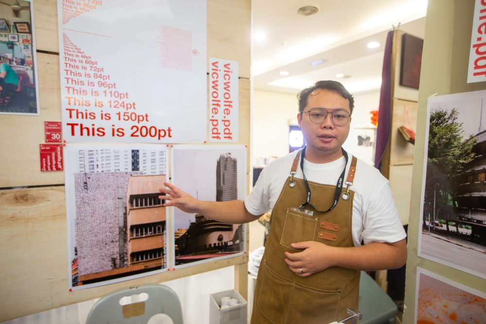 Kuching-born interior architecture lecturer Victor Chin sharing the history of the old Sime Darby building. — Picture by Raymond Manuel