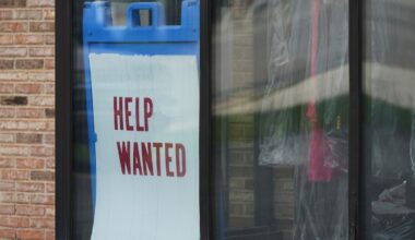 U.S. jobless claims dip below 200,000, layoffs historically low