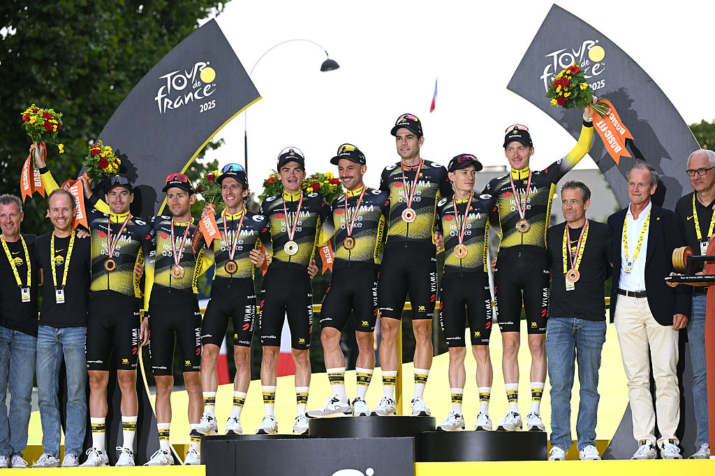PARIS - CHAMPS-ELYSEES, FRANCE - JULY 27: A general view of Jonas Vingegaard of Denmark, Victor Campenaerts of Belgium, Edoardo Affini of Italy, Tiesj Benoot of Belgium, Matteo Jorgenson of United States, Sepp Kuss of United States, Wout Van Aert of Belgium, Simon Yates of Great Britain and Team Visma | Lease a Bike celebrate at podium as best team during the 112th Tour de France 2025, Stage 21 a 132.3km stage from Mantes-la-Ville to Paris - Champs-Elysees / #UCIWT / on July 27, 2025 in Paris - Champs-Elysees, France. (Photo by Dario Belingheri/Getty Images)