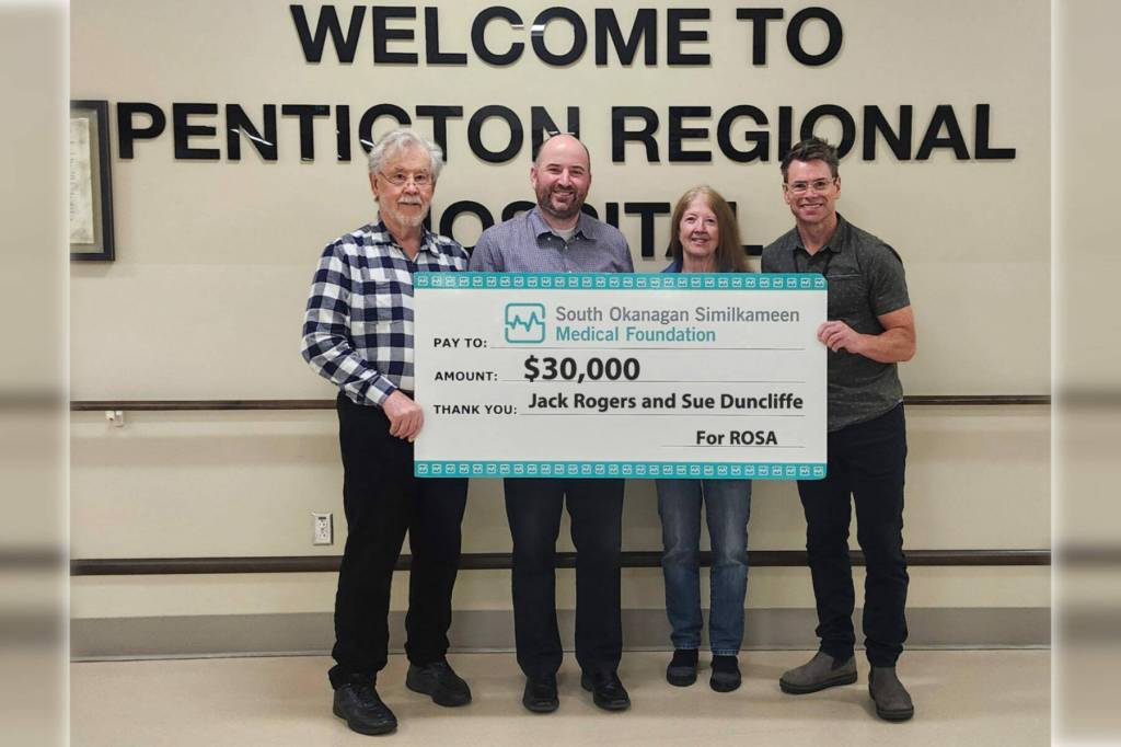 From left to right, Jack Rogers, South Okanagan Similkameen Medical Foundation CEO Ian Lindsay, Susan Duncliffe and Penticton Regional Hospital head of orthopedics Dr. Tim Bell hold a cheque from Rogers and Duncliffe that will go towards the purchase of high-tech equipment for the hospital. (South Okanagan Similkameen Medical Foundation / Submitted)