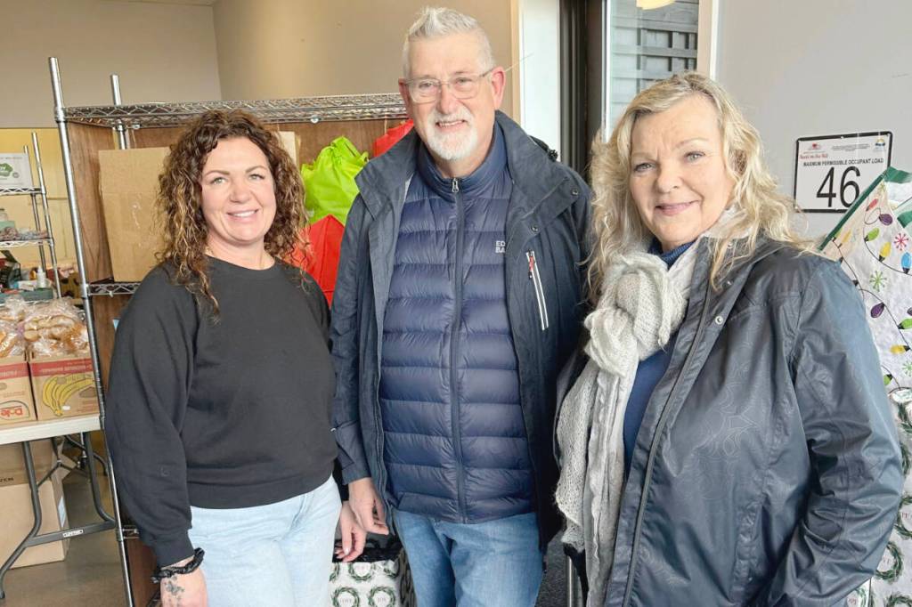 Pictured are Cyndi Beaulieu, president of the Ladysmith Golf Club Society, Mark Evans, interim treasurer, and Eliina Alle, Food Pantry coordinator for the Ladysmith Food Bank, surrounded by the member donations that were delivered to the Ladysmith Food Bank. (Photo courtesy Ladysmith Golf Club Society)