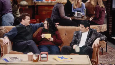 Getty Images Pat Finn next to Courtney Cox and Matt LeBlanc on the set of Friends