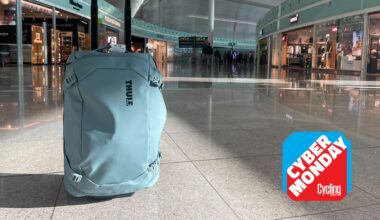 Thule wheeled carry-on in Barcelona airport in front of shops