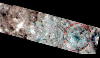 A photo of Europa's surface with a red ring around the spider-like feature