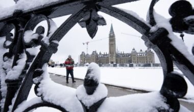 A worker prepares a pathway on Parliament Hill in Ottawa on Monday, Dec. 4, 2023. THE CANADIAN PRESS/Adrian Wyld