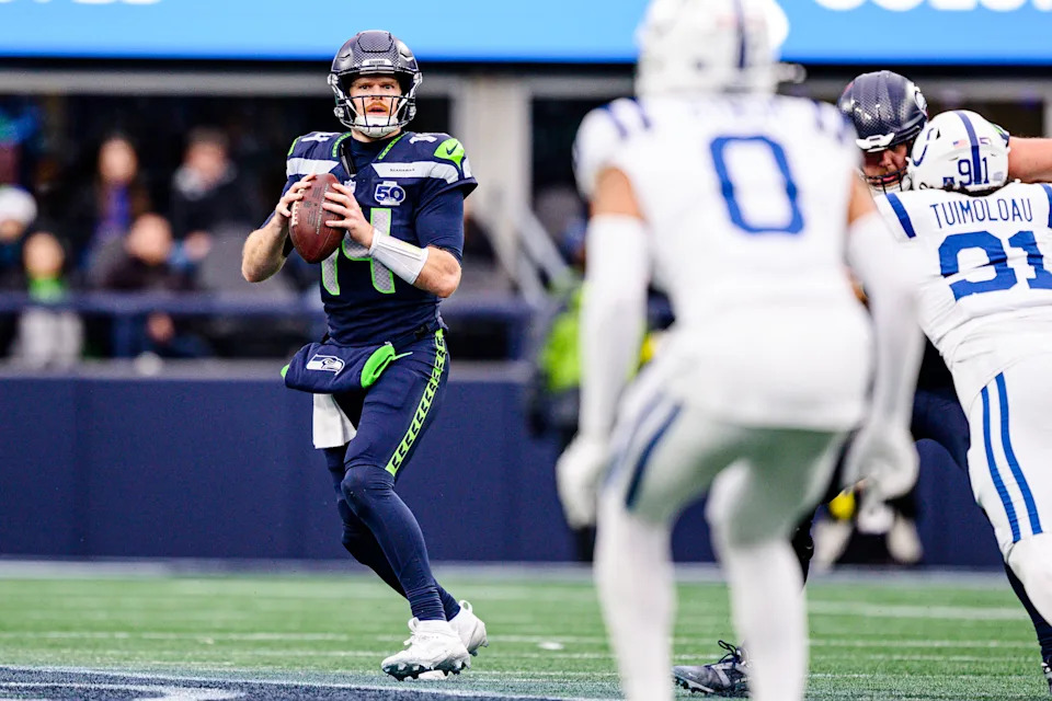 SEATTLE, WASHINGTON - DECEMBER 14: Sam Darnold #14 of the Seattle Seahawks looks for a pass during the fourth quarter of the game against the Indianapolis Colts at Lumen Field on December 14, 2025 in Seattle, Washington. (Photo by Jane Gershovich/Getty Images)