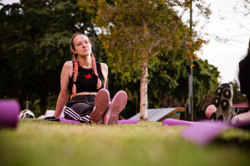 Participants smiling in a boxing class.