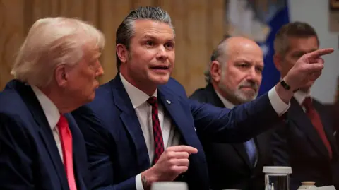 Getty Images Pete Hegseth and Donald Trump in the cabinet room of the White House. 