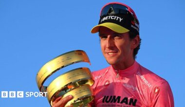 Simon Yates holds the Giro d'Italia trophy