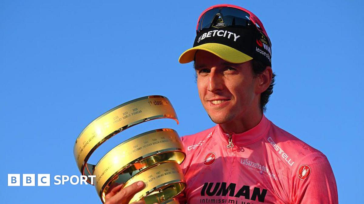 Simon Yates holds the Giro d'Italia trophy