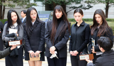NewJeans members respond to questions from the media at the Seoul Central District Court in Seocho District, southern Seoul, on March 7. [NEWS1]