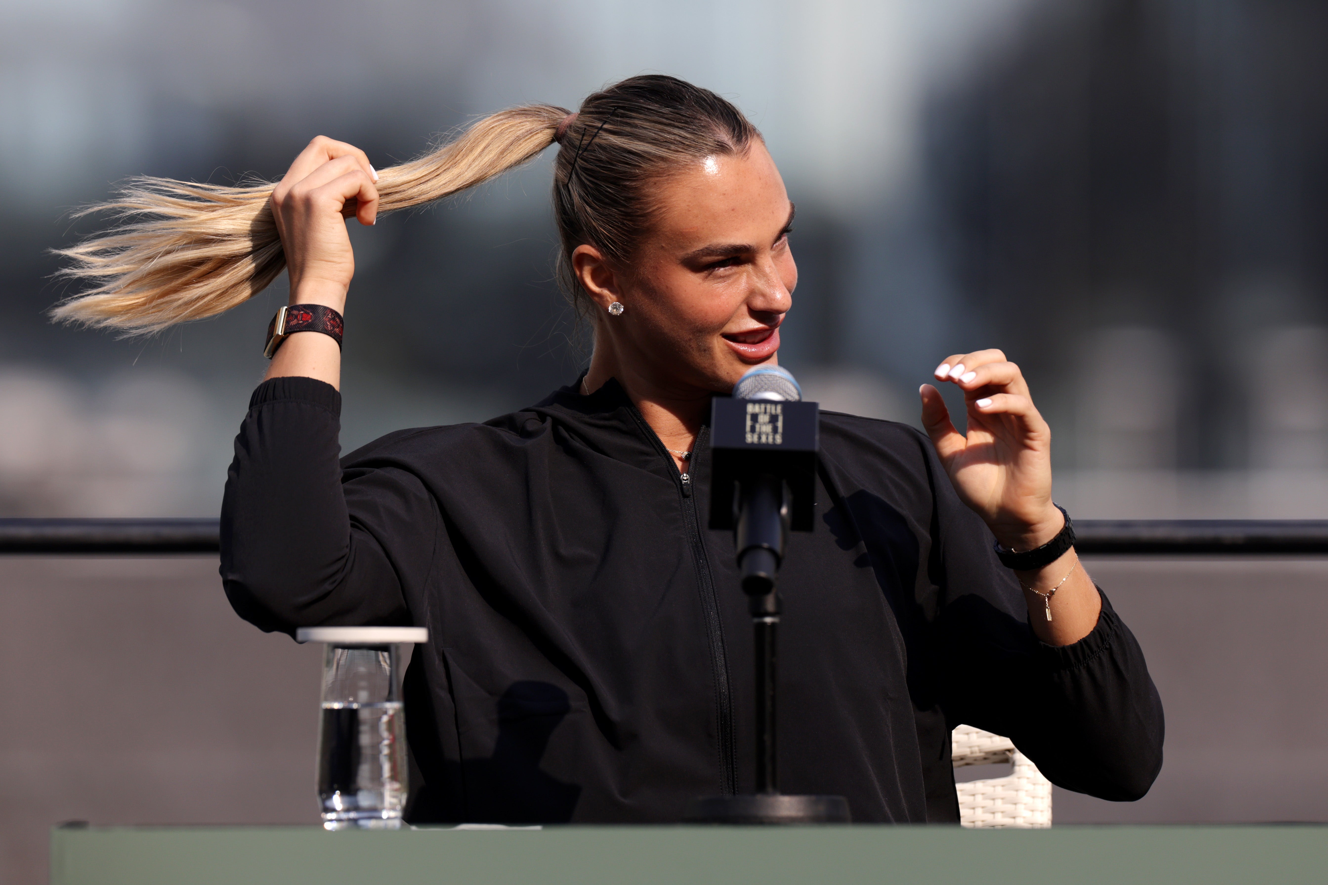 Aryna Sabalenka reacts during a press conference