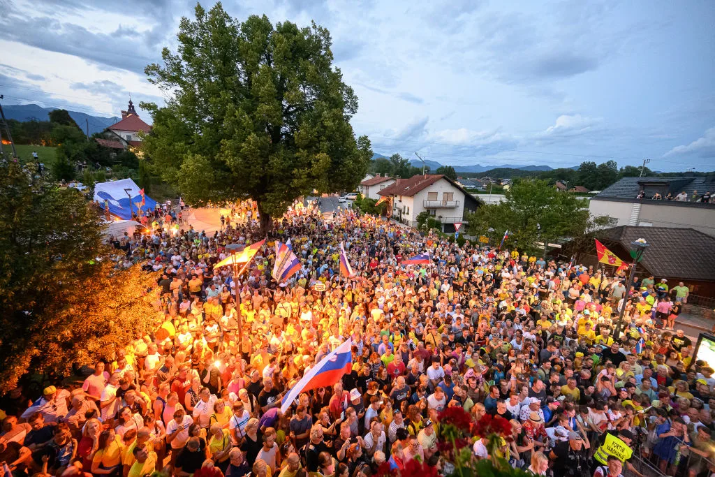 Fans of Slovenian cyclist Tadej Pogacar gather for a reception to celebrate his wins at the Giro d'Italia and Tour de France at his hometown in Komenda on July 24, 2024. (Photo by Jure Makovec / AFP) (Photo by JURE MAKOVEC/AFP via Getty Images)