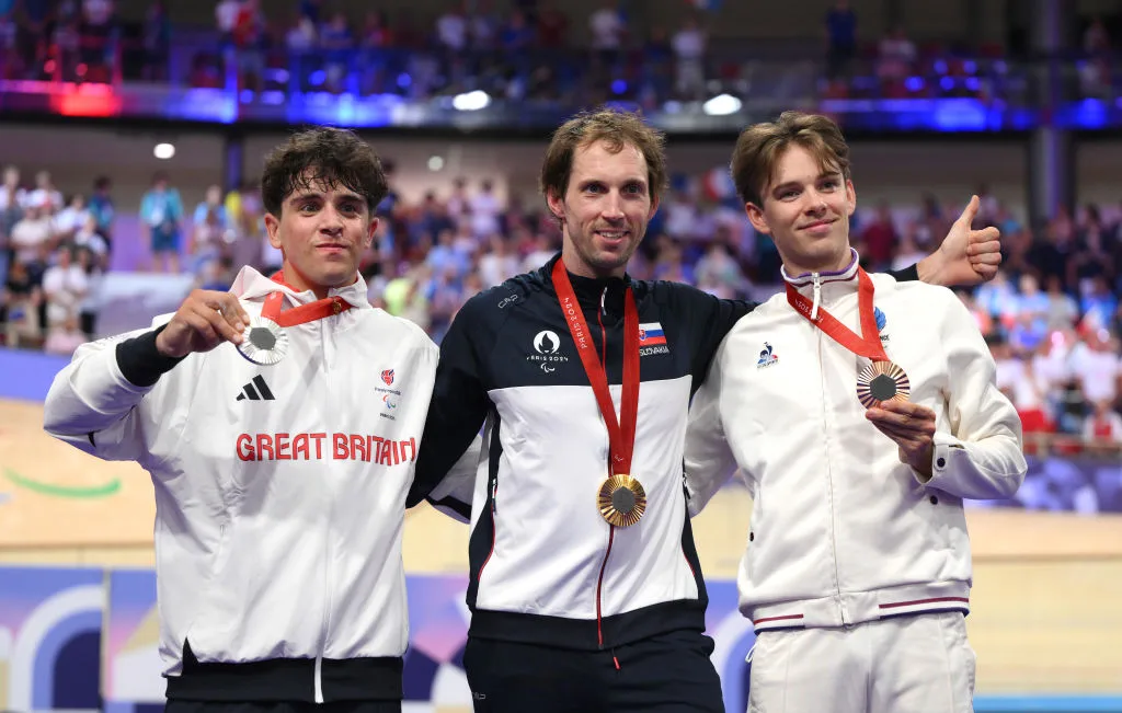 Silver medalist, Archie Atkinson of Team Great Britain, gold medalist, Jozef Metelka of Team Slovakia, and bronze medalist, Gatien Le Rousseau of Team France, pose for a photo during the medal ceremony for the Men's C4 4000m Individual Pursuit Final on day three of the Paris 2024 Summer Paralympic Games