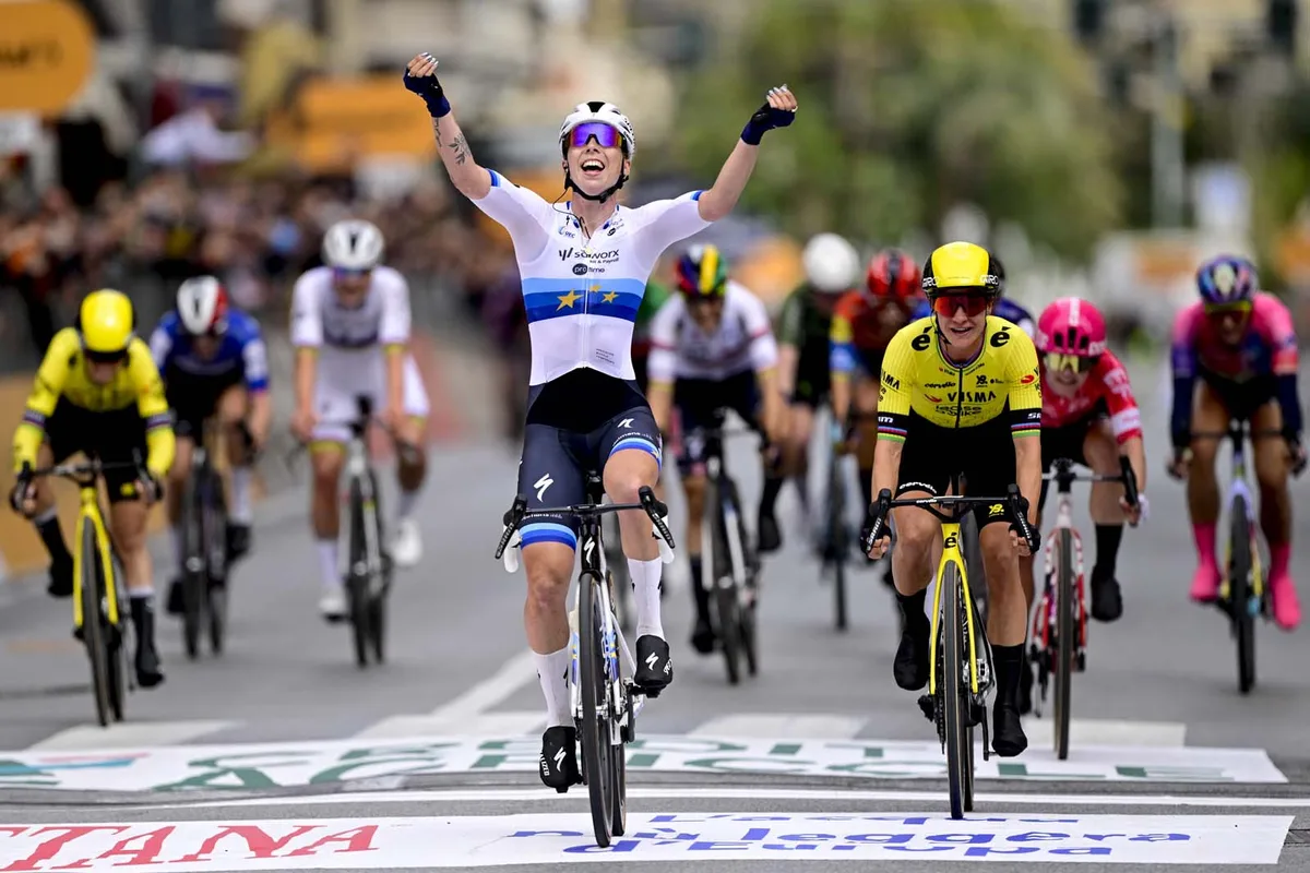 Dutch Lorena Wiebes of SD Worx-Protime (C) celebrates as she crosses the finish line, before Dutch Marianne Vos of Team Visma-Lease a Bike (R), winning the sprint at the finish of the 'Milano-Sanremo Donne' one day cycling.