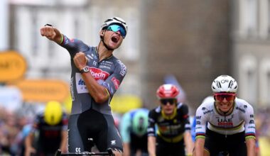 Mathieu van der Poel celebrates winning stage 2 of Tour de France 2025 with Tadej Pogacar in background.