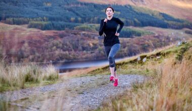 Woman running up a hill in the wilderness