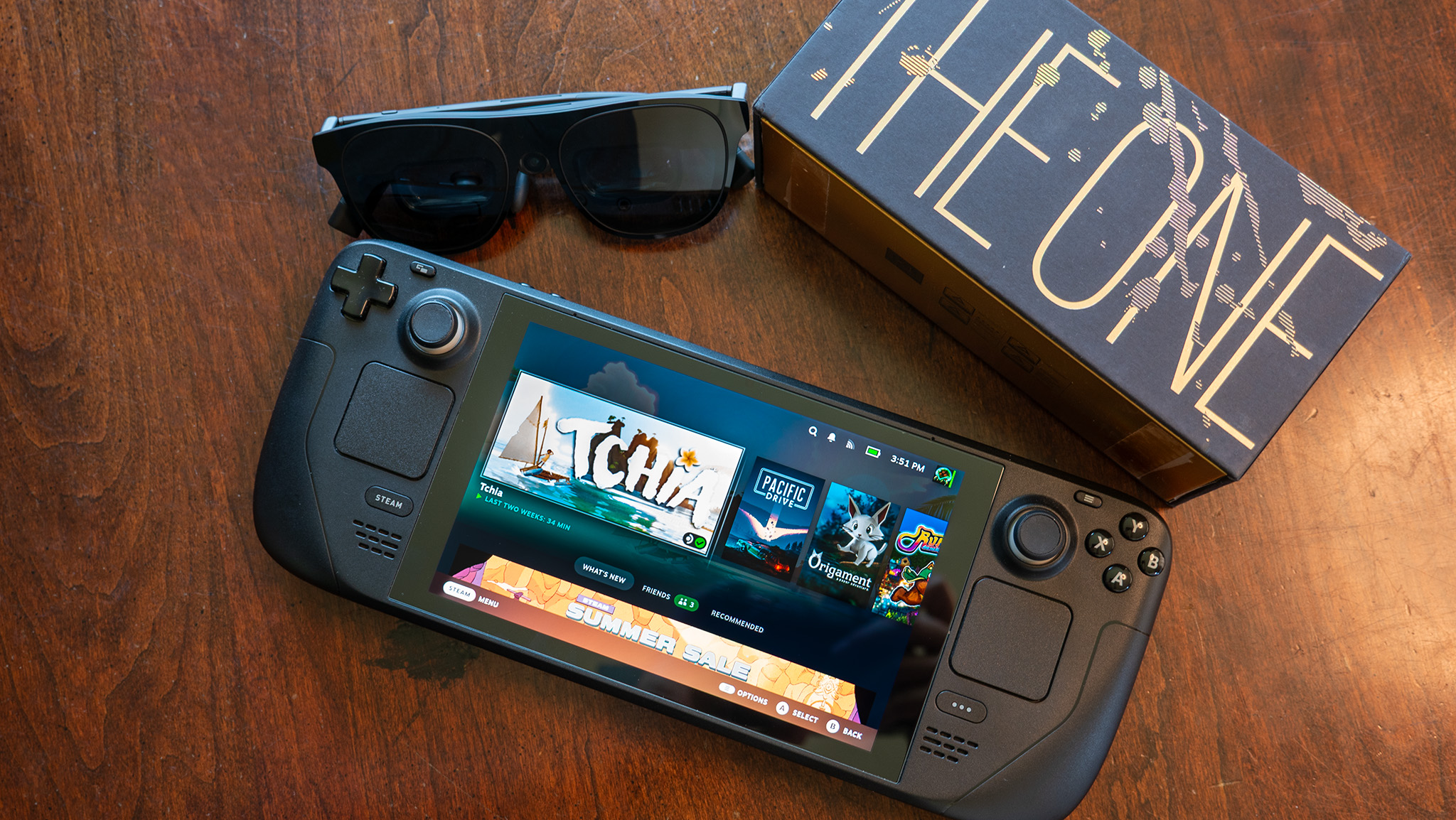 A Steam Deck and Xreal One Pro glasses