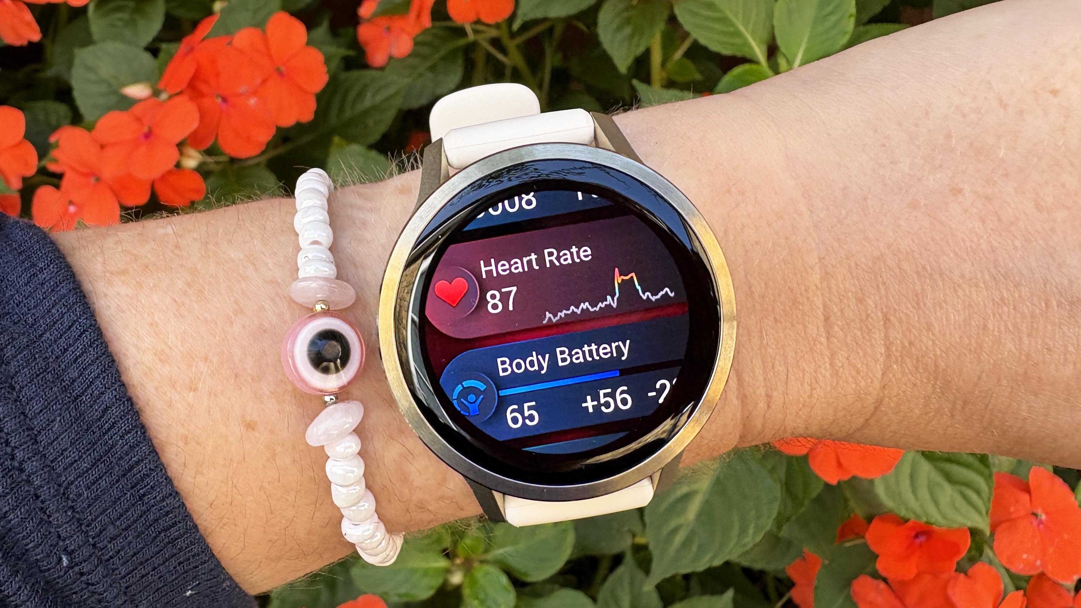 the Garmin Venu 4 in lunar gold on the wrist