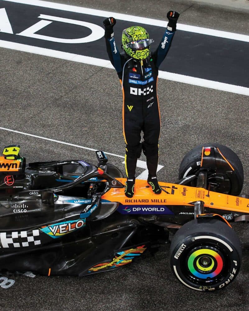 Lando Norris, Formula 1 world champion 2025 stands on car