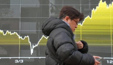 World shares advance, Japan raises its key interest rate