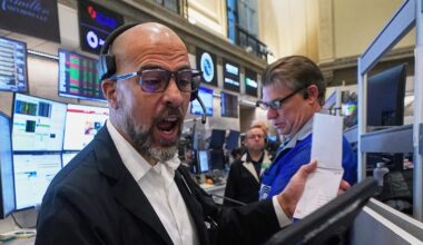Wall Street hovers near record levels