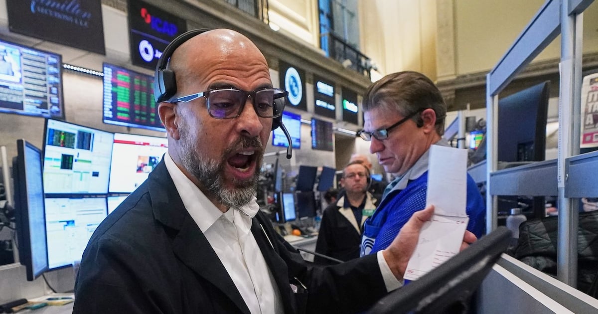 Wall Street hovers near record levels
