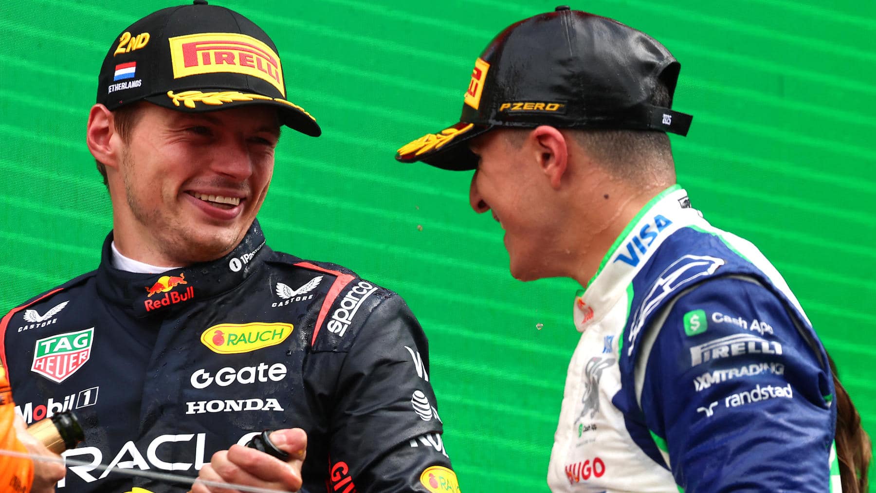 Max Verstappen and Isack Hadjar on the podium at the Dutch GP
