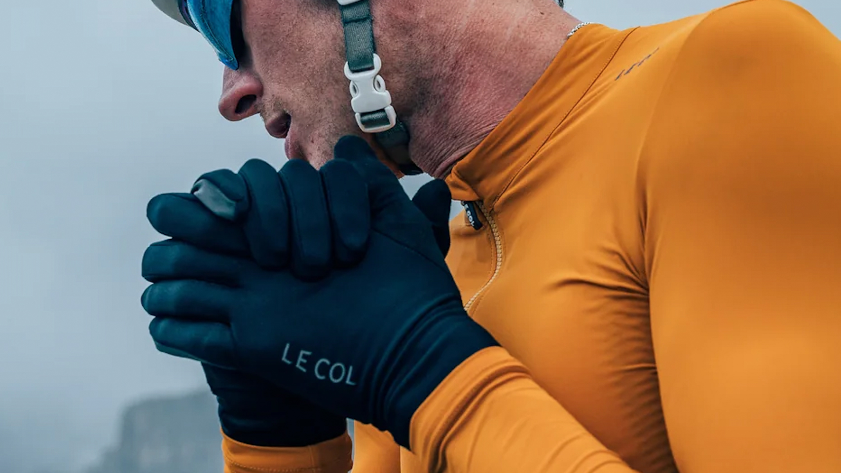 Cyclist wearing the Le Col Pro Lightweight Gloves