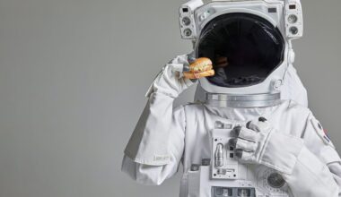 Astronaut holding up a burger
