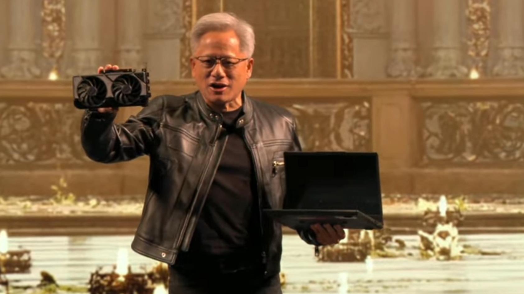 Nvidia CEO Jensen Huang holding an RTX 5060 at Computex 2025