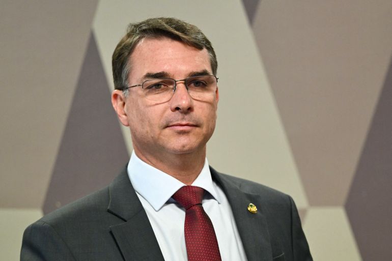 Senator Flavio Bolsonaro, son of former President Jair Bolsonaro, attends a session of the committee discussing the bill that reduces the sentences of those convicted of attempted coup d'etat in Brasilia, on December 17, 2025.