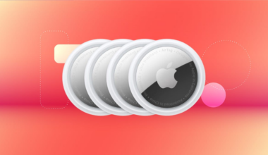 Shows four Apple AirTags on a red background.