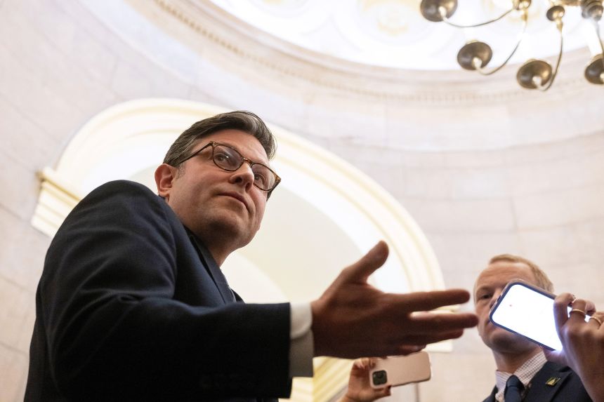 House Speaker Mike Johnson talks to reporters outside his office in the US Capitol, on Thursday, December 4, 2025.