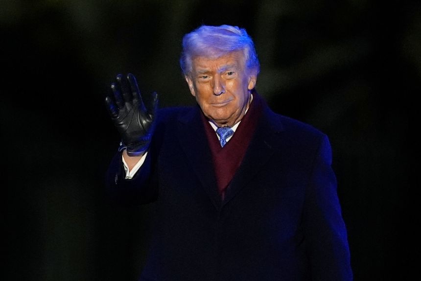 President Donald Trump waves to supporters during the lighting of the National Christmas Tree in Washington, DC, on December 4, 2025.