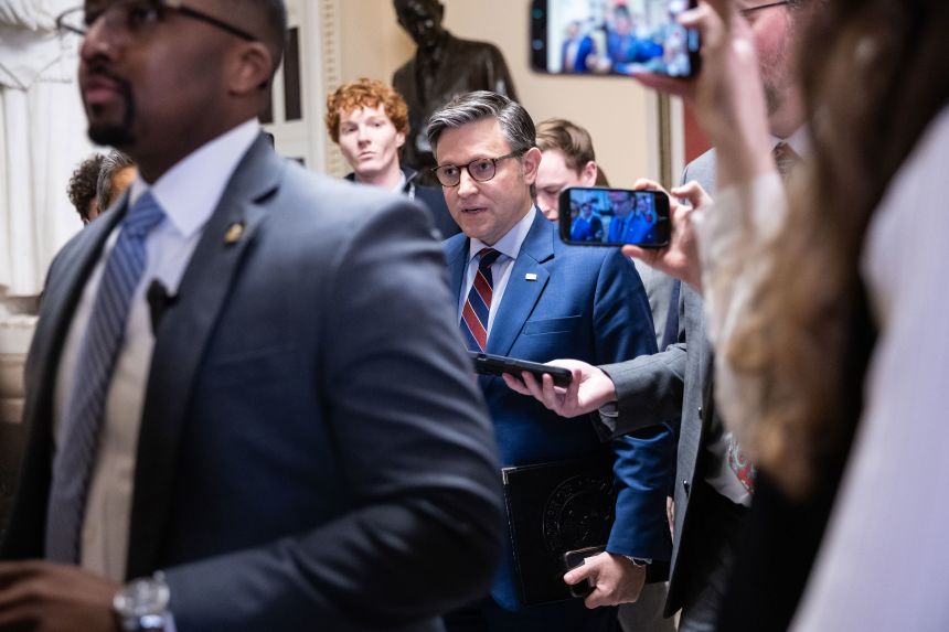 House Speaker Mike Johnson (R-La.) speaks with reporters as he walks to a vote at the U.S. Capitol Dec. 11, 2025. (Francis Chung/POLITICO via AP Images)