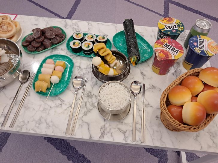 A table display recreates the Korean snacks enjoyed by the Huntrix members in the airplane cabin in the film 'KPop Demon Hunters.' Korea Times photo by Kim Se-jeong