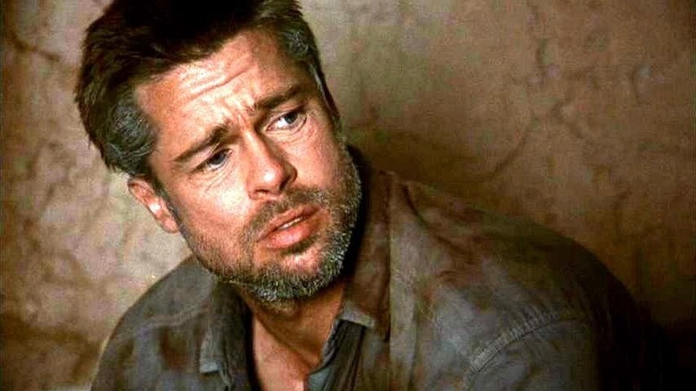 Richard looking unsettled with dirt on his collar in Babel