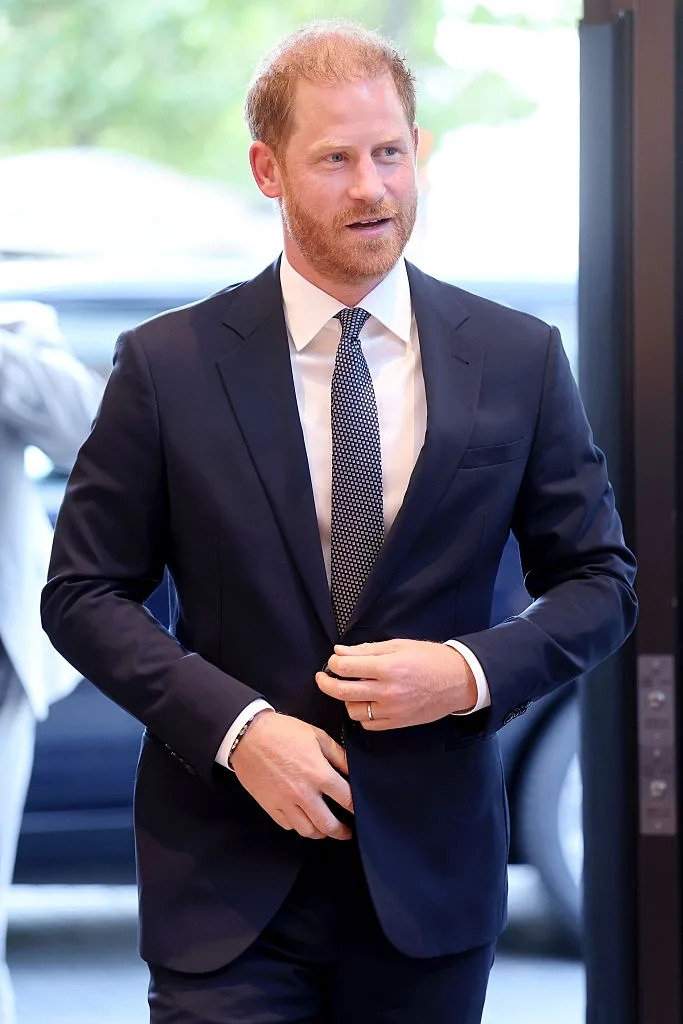 Man in a suit with a patterned tie at an event