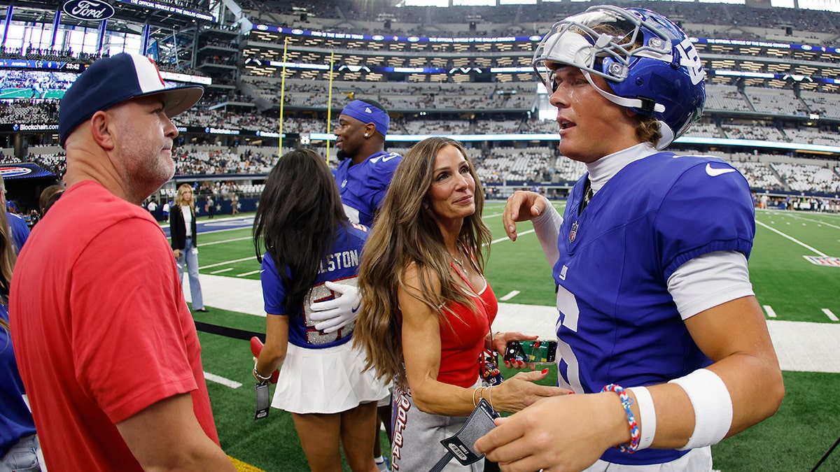 Brandon and Jaxson Dart before game