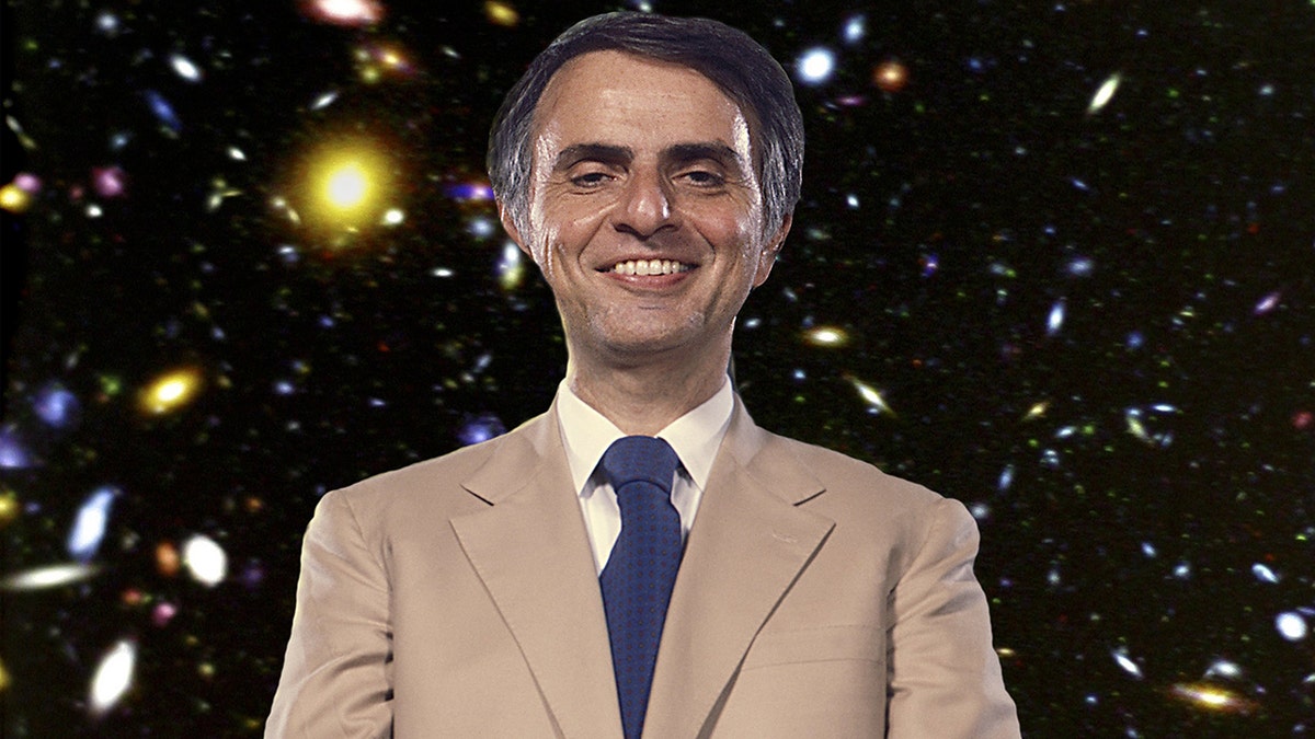 Carl Sagan posing at Florida State University with stars in the background in 1984.