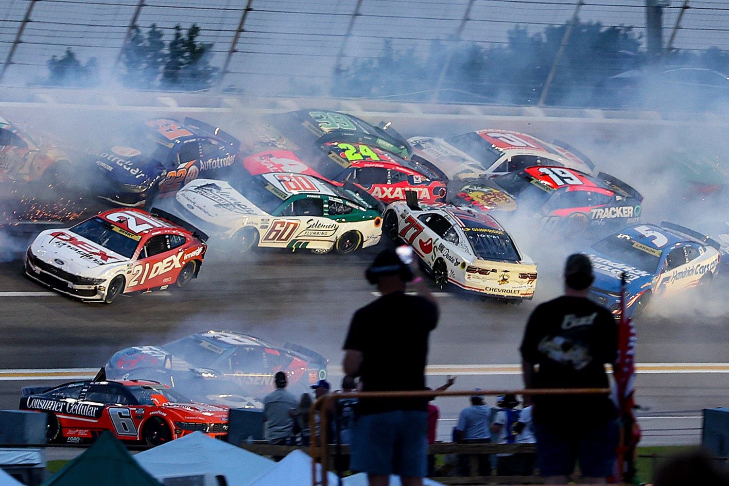Josh Berry, driver of the #21 DEX Imaging Ford, Ryan Preece, driver of the #60 Solomon Plumbing Ford, Carson Hocevar, driver of the #77 Chili's Ride the 'Dente Chevrolet, and Kyle Larson, driver of the #5 HendrickCars.com Chevrolet, spin after an on-track incident during the NASCAR Cup Series Quaker State 400 Available at Walmart at Echo Park Speedway on June 28, 2025 in Hampton, Georgia. (Photo by Krista Jasso/Getty Images)