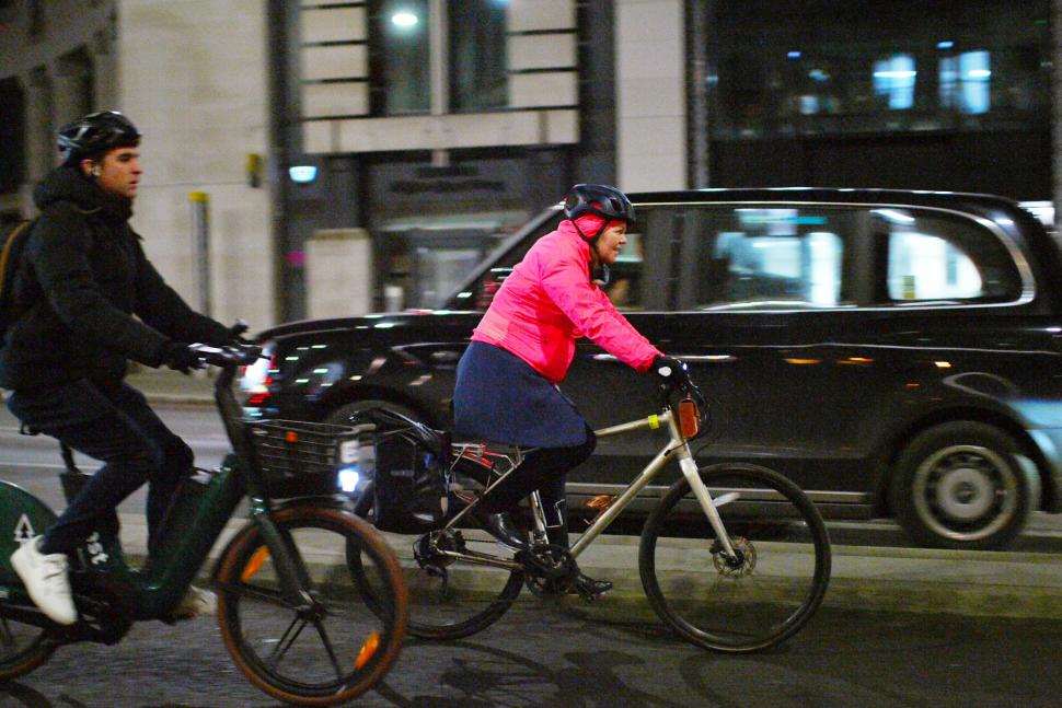 Cyclists in London male and female in cycle lane