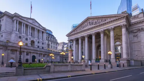 Getty Images Bank of England building at dusk with street lamps on.
