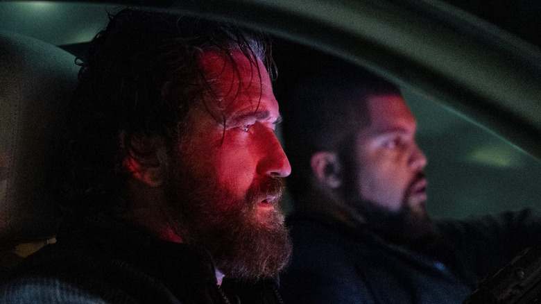 Big Nick and Donnie sitting in a car in Den of Thieves: Pantera