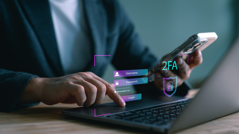 Man entering a code on PC sent to his iPhone for 2FA